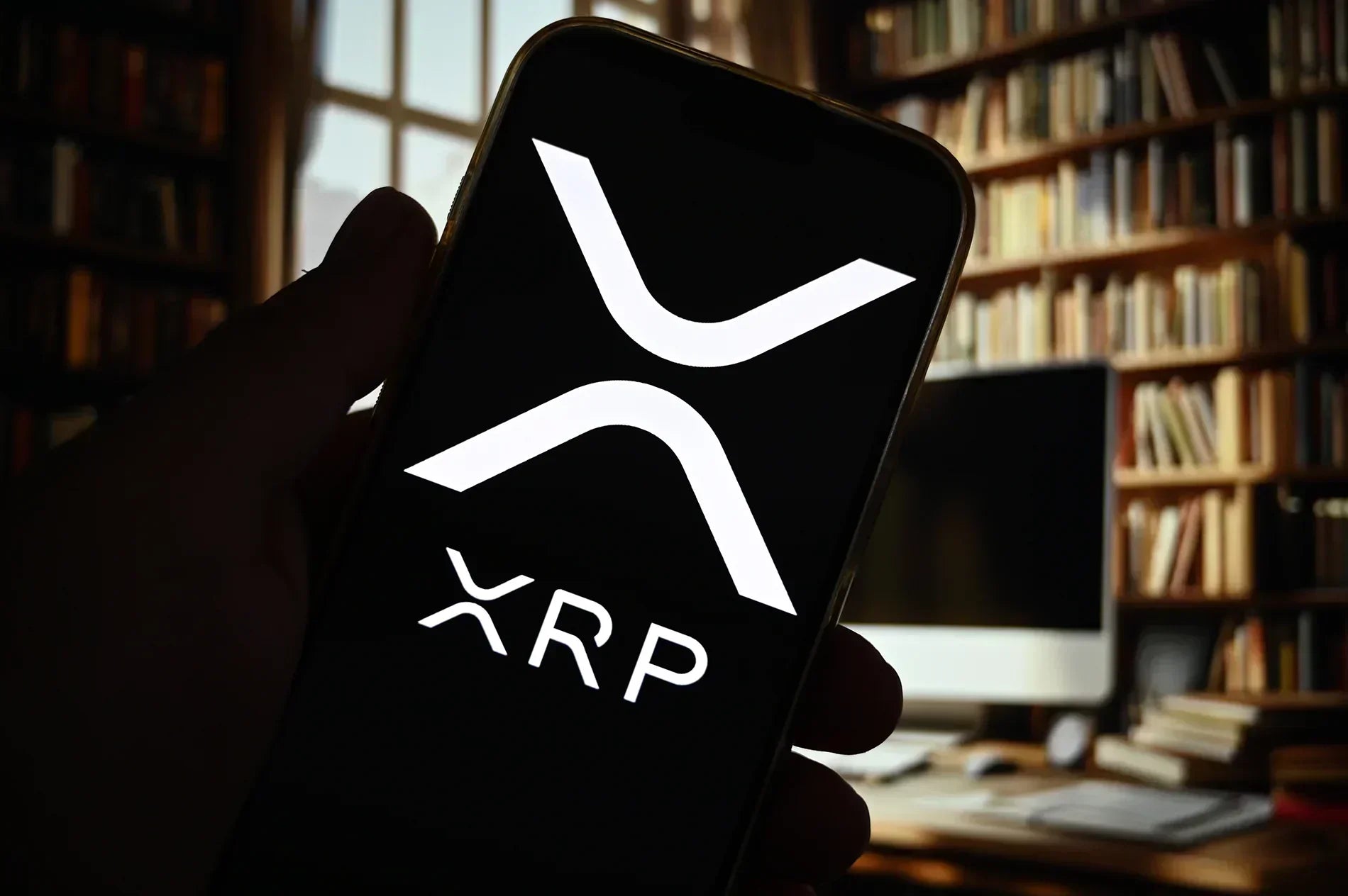 XRP on cell phone in hand