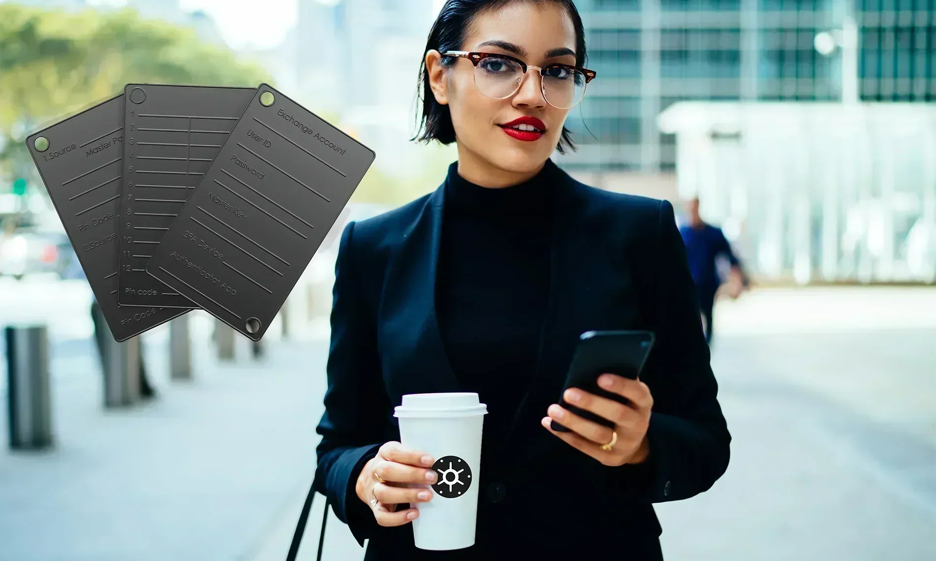 Woman holding coffee cup and cellphone, plus Black Seed Ink steel wallets in the foreground.