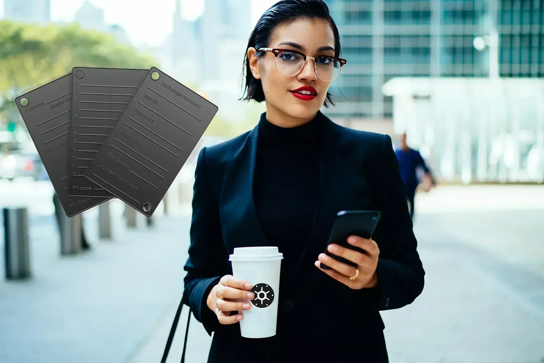 Woman holding coffee cup and cellphone, plus Black Seed Ink steel wallets in the foreground.