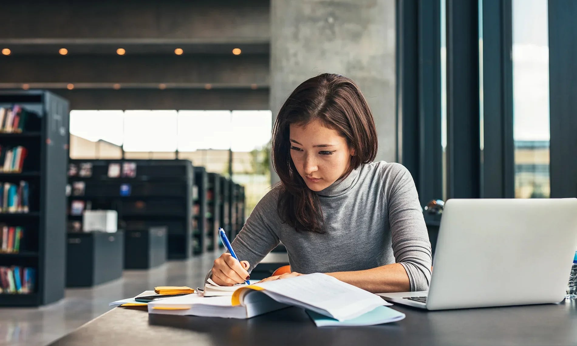 woman studying at the library