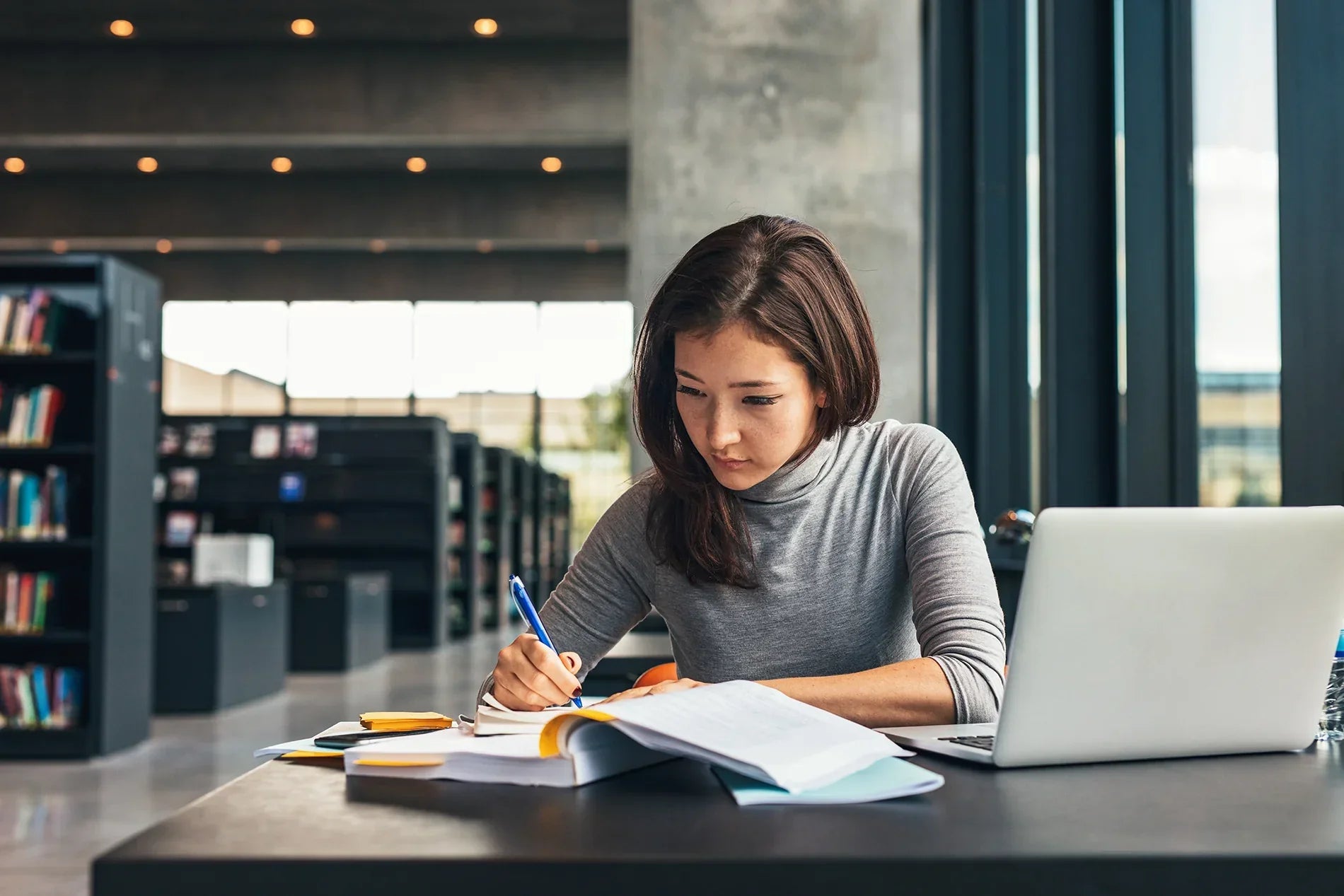woman studying at the library