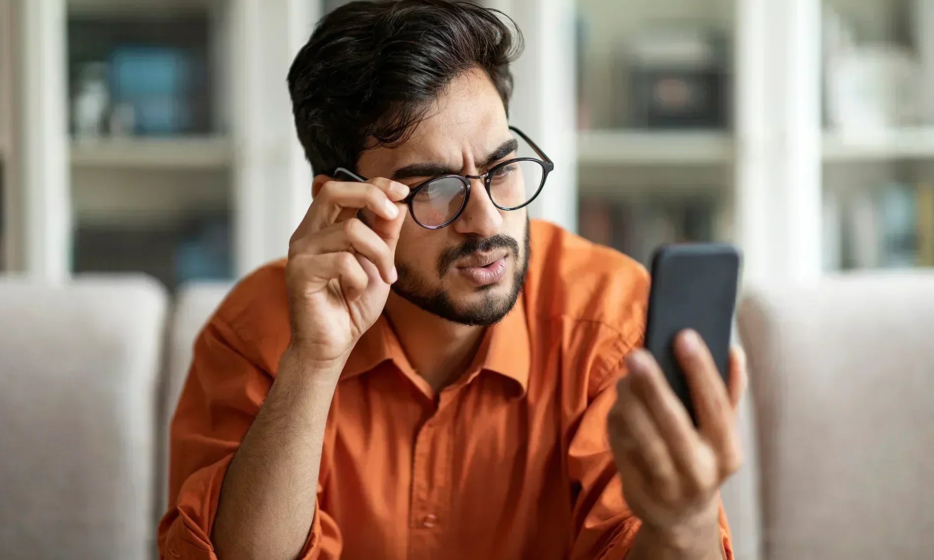 Man looking at his smartphone device