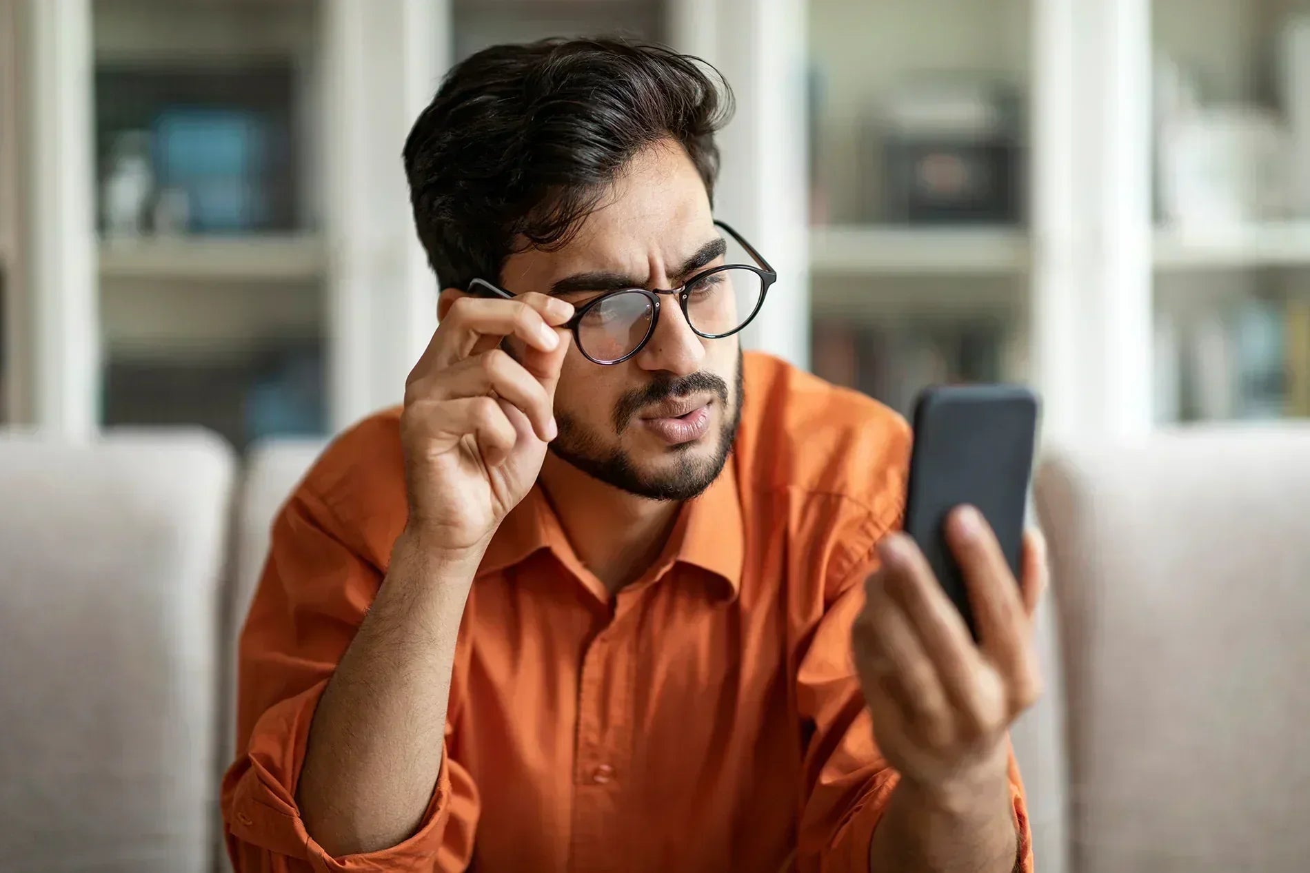 Man looking at his smartphone device