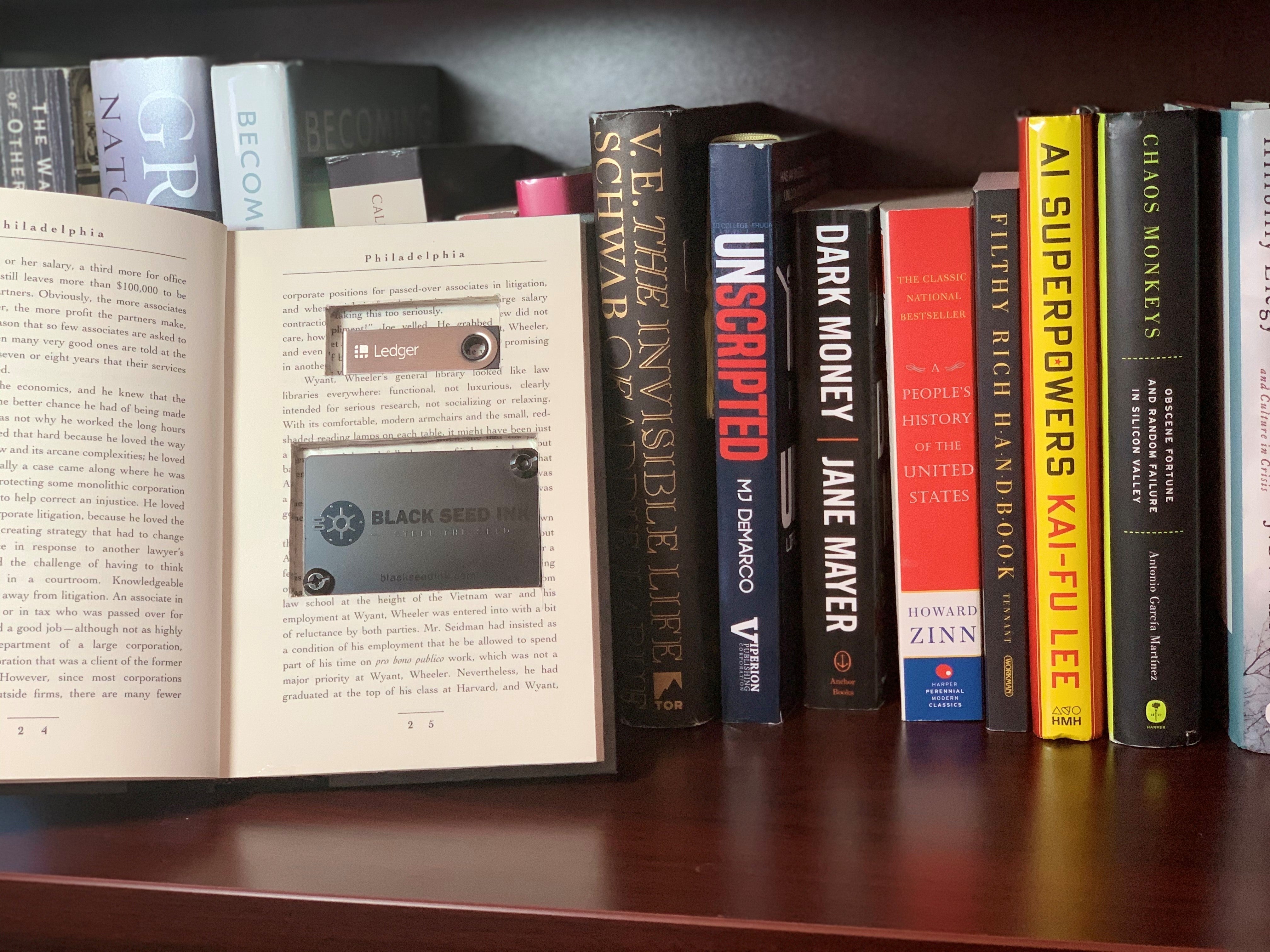 Bookshelf with an open book that has been carved out for secret storage.