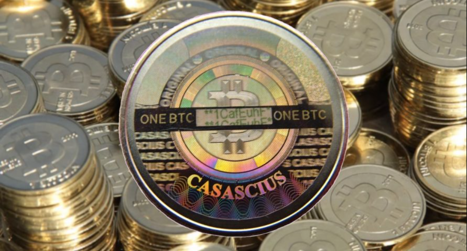 Silver stacks of coins with Bitcoin symbol embossed.