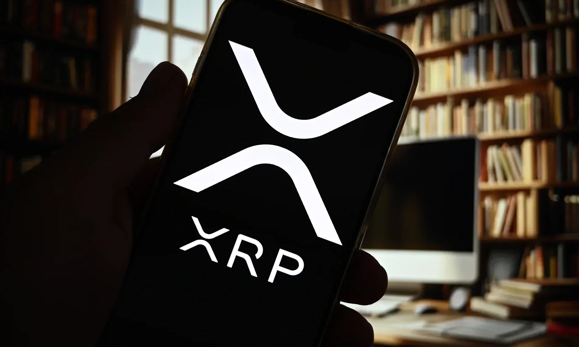 XRP on cell phone in hand