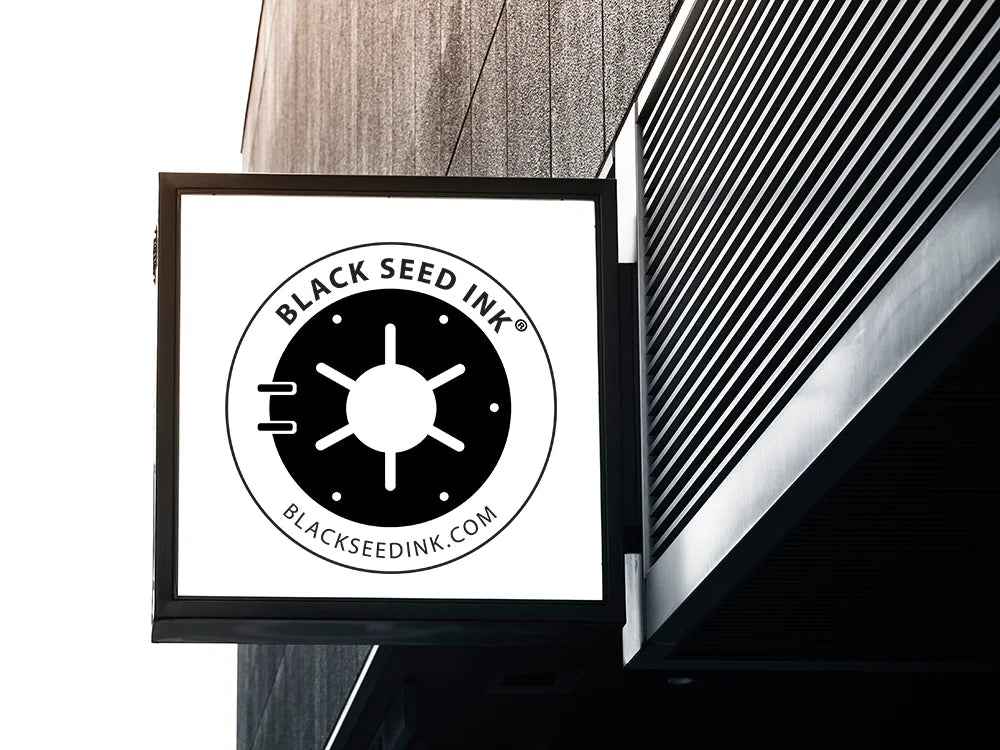 Exterior sign on modern building displays the Black Seed Ink logo
