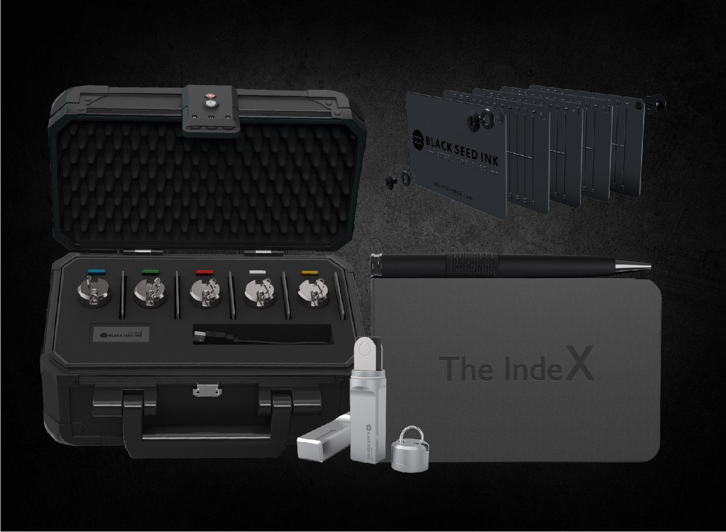 Black Seed Ink crypto security kit featuring a secure storage case with multiple locking mechanisms, a set of metal seed phrase plates, The IndeX notebook with a pen, and additional security accessories for safeguarding cryptocurrency assets.